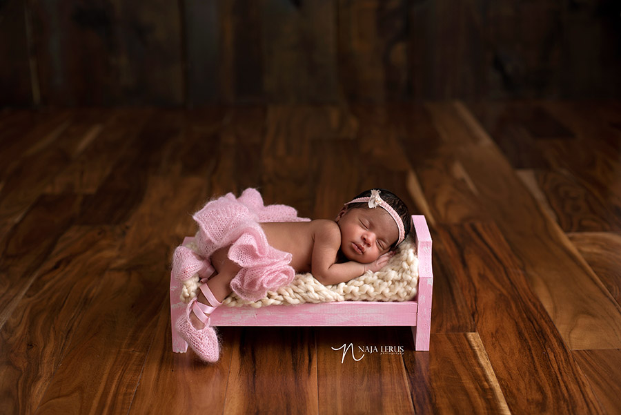 newborn lace tutu on newborn baby girl chicago IL in little bed