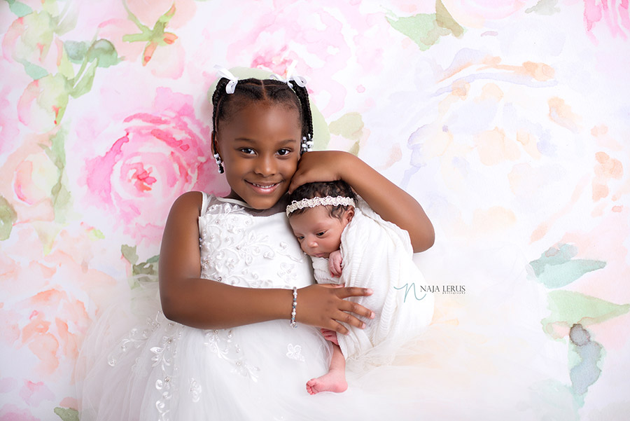 sisters sibling shot in newborn session chicago