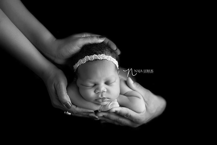 newborn photos baby in hands black and white photo chicago IL