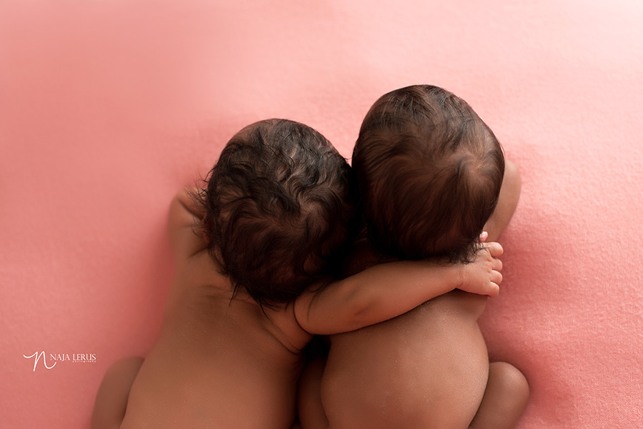 twin babies hugging newborn photography chicago IL