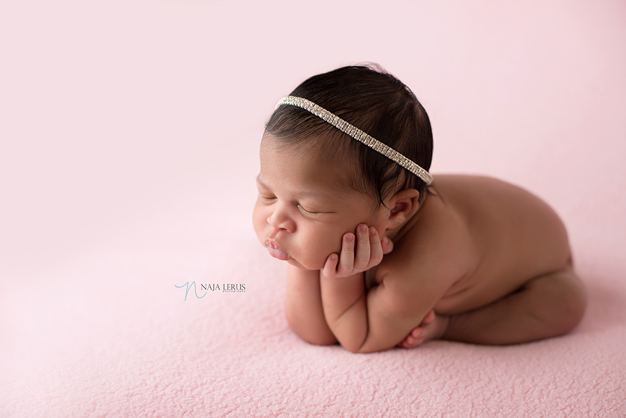 head in hands newborn photographer