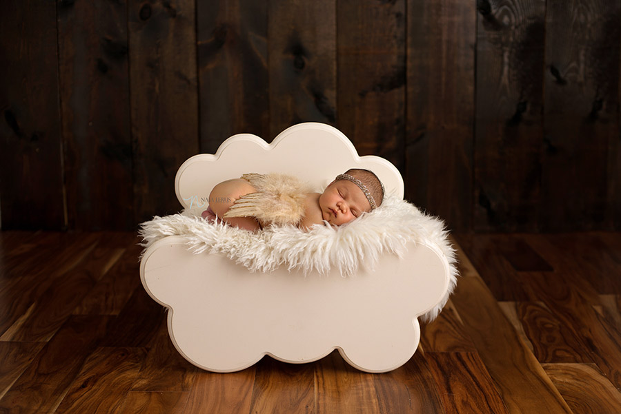 newborn baby on cloud prop