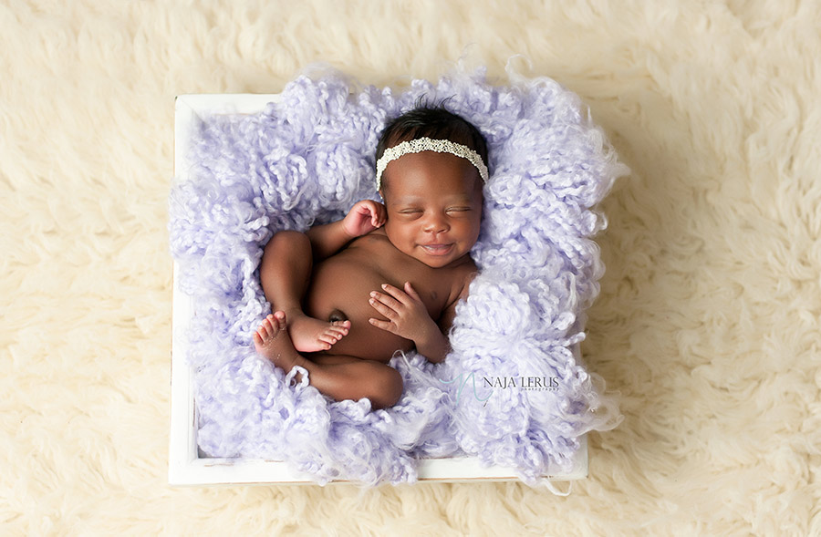 happy baby newborn smiles chicago photographer