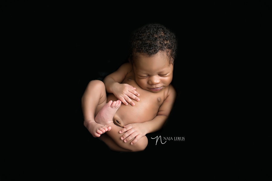 chicago il newborn photographer baby on black modern photography
