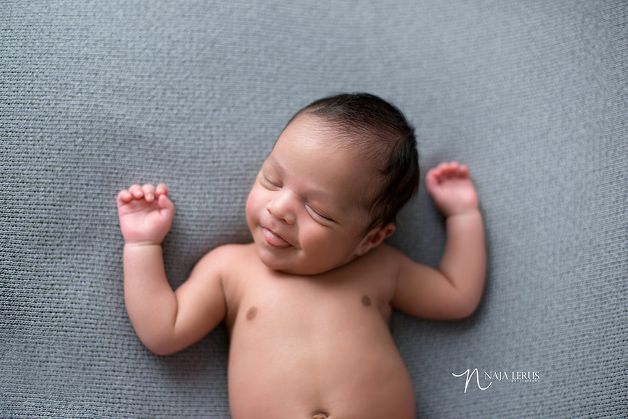 happy baby natural pose image chicago photographer unposed