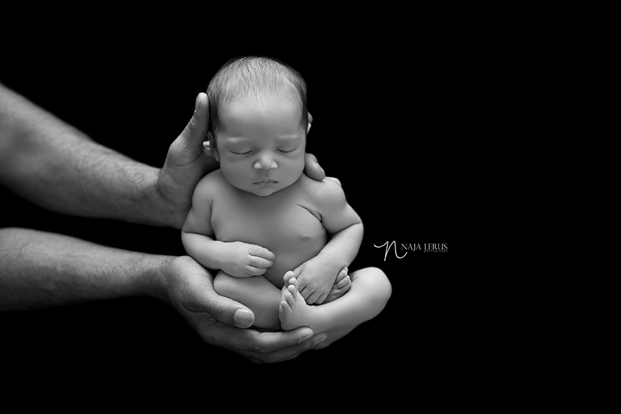 black and white picture baby in dad hands chicago