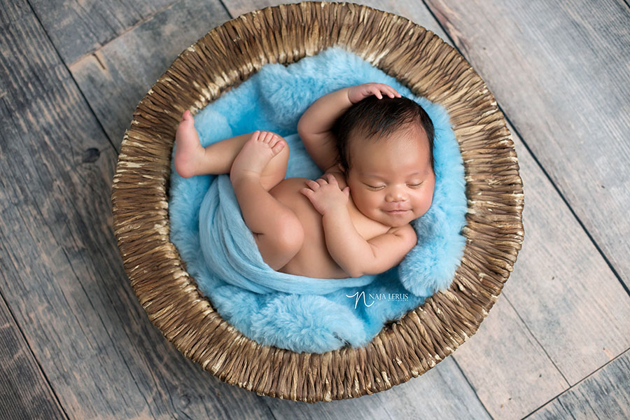 smiling baby in prop shot art pose chicago